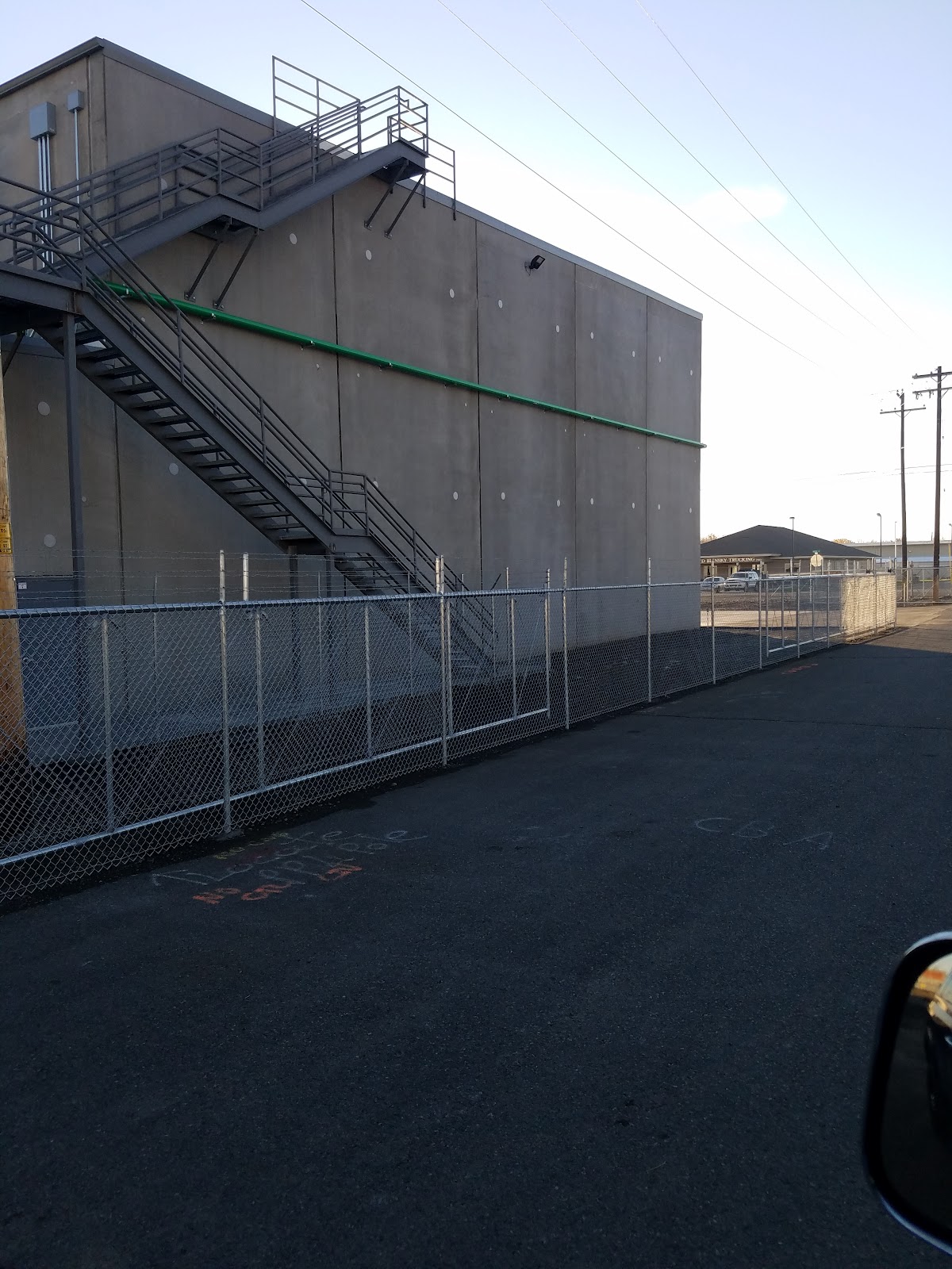 Commercial galvanized chain link fence installed along an industrial Yakima property